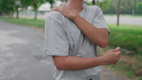 Young man massaging himself after exercising to relieve pain. Health exercise Stock Footage 283186989