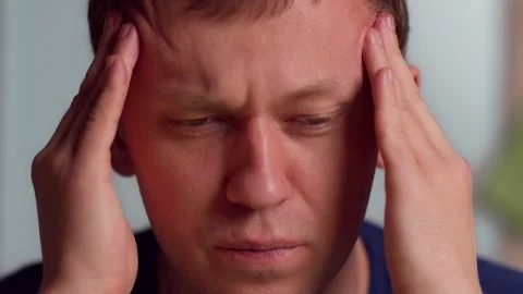 Young man massaging temples, headache, close-up Stock Footage 142959854