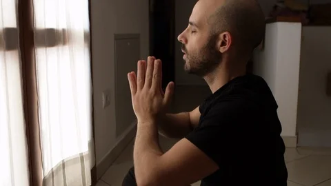 Young man meditation in front of the window. Health and relaxation. Yoga concept Video stock 127249589