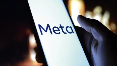 Young man with meta by facebook logo on his phone. cyberspace network Stock Footage 175211962