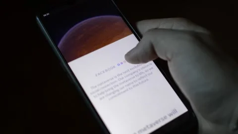 Young man with meta by facebook logo on his phone. cyberspace network Stock Footage 175685495