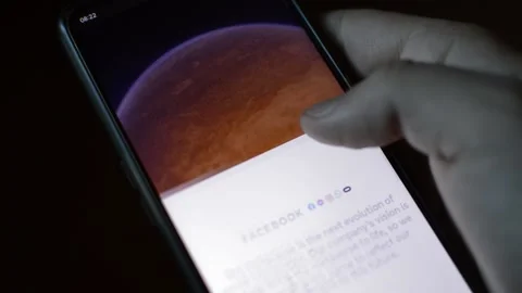 Young man with meta by facebook logo on his phone. cyberspace network Stock Footage 175686449