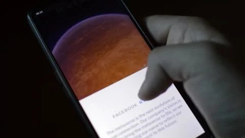 Young man with meta by facebook logo on his phone. cyberspace network Stock Footage 175687551