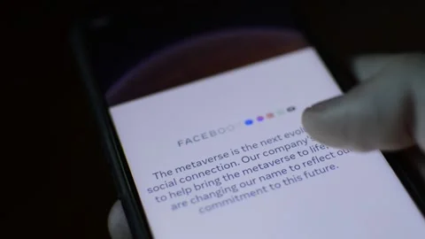 Young man with meta by facebook logo on his phone. cyberspace network Stock Footage 175688347