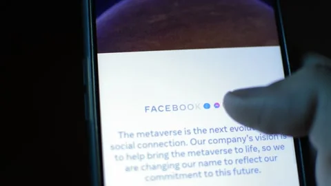 Young man with meta by facebook logo on his phone. cyberspace network Stock Footage 175688412