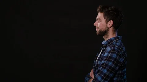 A Young Man Mimicing Against a Black Background Stock Footage 88380960