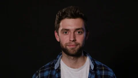 A Young Man Mimicing Against a Black Background Stock Footage 88438352