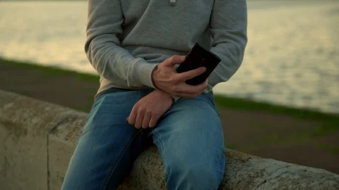 Young man with mobile phone 動画素材 89789006