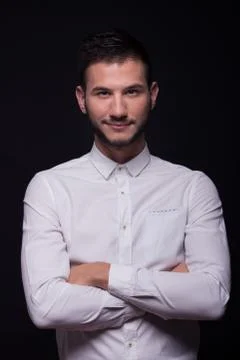 Young man model posing, white shirt smiling Stock Photos