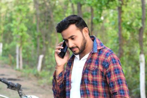 Young man model talking with his cell phone Foto stock