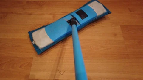 Young man with Mop, Cleaning Floor at Home. Man Sweeps Dust in room and brings Stock Footage 106465481
