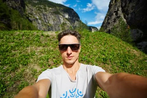 Young man on the morning mountains background Stock Photos