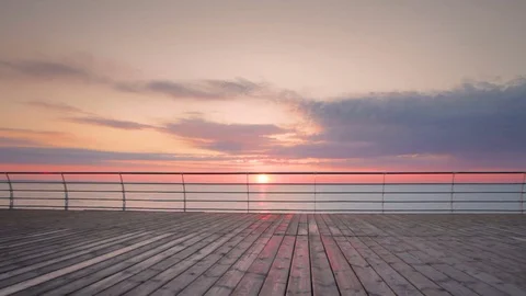 Young man with mountain bike on seafront during sunset or sunrise Vídeos de archivo 75770048