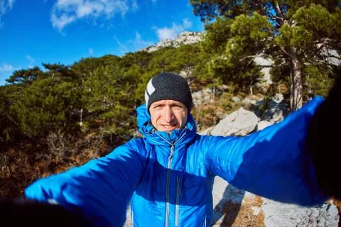 Young man in the mountains Stock Photos
