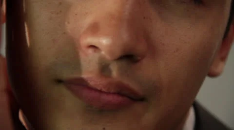 Young Man moves hands on his cheek Stock Footage 22831799