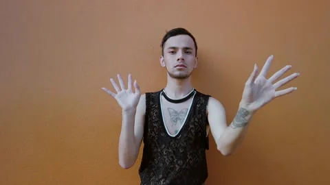 Young man moving his hands sensually while doing vogue dancing. Stock Footage 192078463
