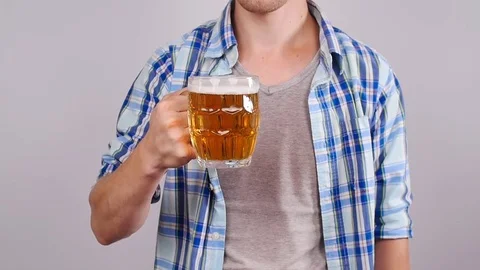 Young Man with a mug of beer Stock Footage 78539879