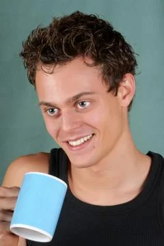Young man with mug Stock Photos