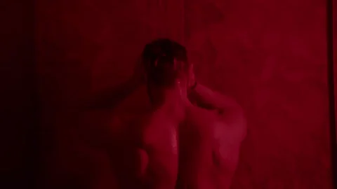 Young man muscular guy bodybuilder on which water pours Portrait of Sexy Male Stock Footage 239554260