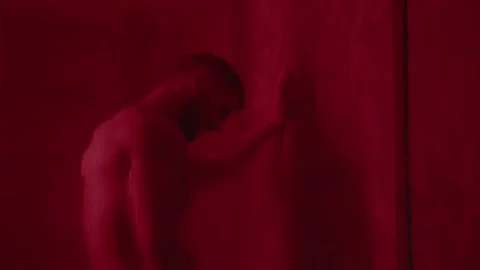 Young man muscular guy bodybuilder on which water pours Portrait of Sexy Male Video stock 239554687