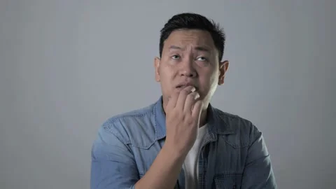 Young Man Nervous Afraid or Worried of Something Stock Footage 143517101