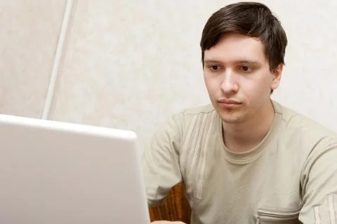Young man with notebook indoors Stock Photos