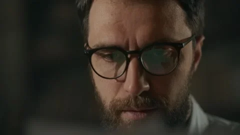 Young man in office read documents. Businessman makes notes on paper while Stock Footage 247895295