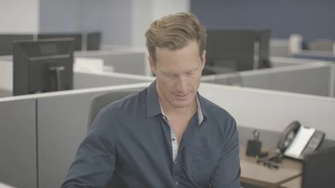 Young man in office working on computer Stock Footage 94231902