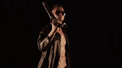 Young man with an old gun Stock Footage 82971708