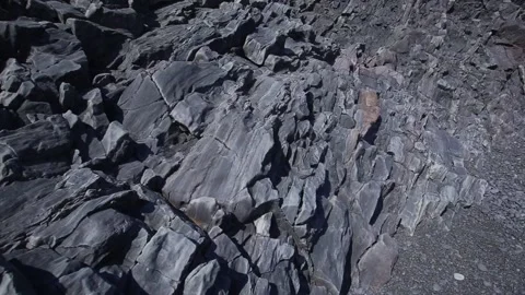 A young man on one of the black beaches of the Snaefellsnes peninsula. Iceland Stock Footage 130952622