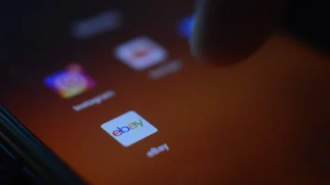 Young man open ebay online shopping app on his phone Vidéo 196791224