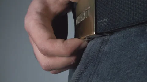 Young Man Opening A Belt Side-Shot Video stock 36793072