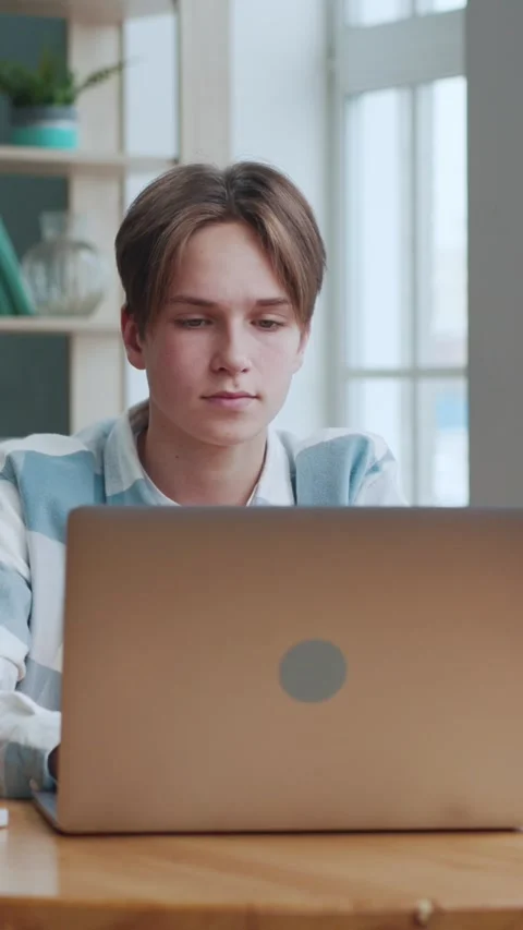 Young Man Opening Laptop Computer and Typing Homework or Typing Education Text Stock Footage 312084662