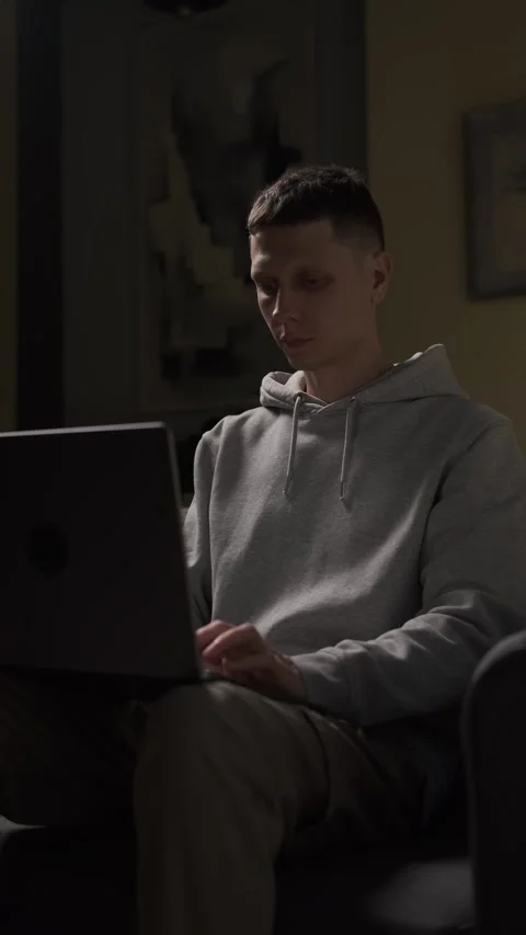 Young man opening laptop to continue working on important project at home in Stock Footage 314893560