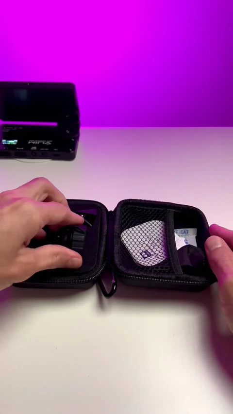 A young man opens a case with a phone lens and examines it.  Unpacking the goods Stock Footage 237763371