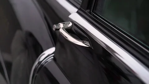 Young man opens door of old car Video stock 84316869