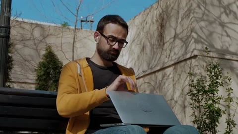 Young Man Opens Laptop For Use Stock Footage 239892996