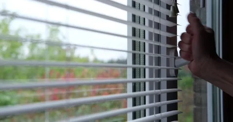 A young man opens a plastic window with one hand. Stock Footage 139147607