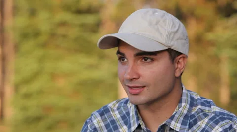 Young man outdoors taking on cell phone Stock Footage 61669802
