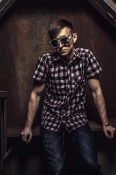 Young man over rusty background Stock Photos