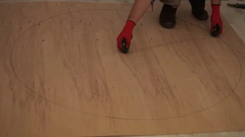 A young man paint circle on the sheet Stock Footage 86817679