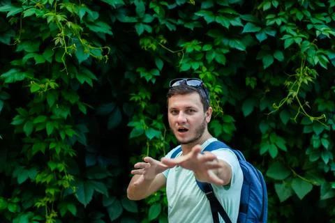 A young man in the park with a backpack Stock Photos