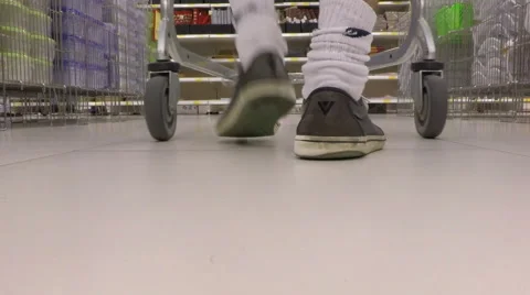 Young man pass over the camera with shopping cart in the store Video stock 54629855