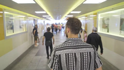The young man passing through the underpass. Video stock 212692081
