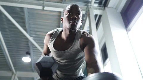 Young Man Perform Tricep Kickback's At Gym Stock Footage 98796476