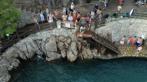 Young Man Performing Backflip Jump into Sea - Akyaka Turkey 16 Aug 2023 Stock Footage 329379718