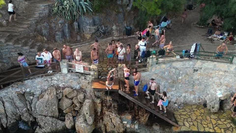 Young Man Performing Backflip Jump into Sea in Akyaka - Turkey 16 Aug 2023 Stock Footage 329382312