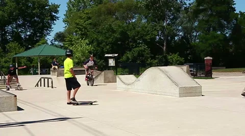 Young man performing a radical bmx jump at skatepark Stock Footage 40778320