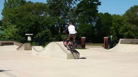 Young man performing a radical bmx jump at skatepark Stock-Footage 40778545