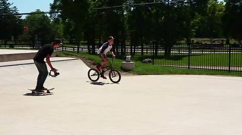 Young man performing a radical bmx jump at skatepark in slow motion Stock Footage 40975717